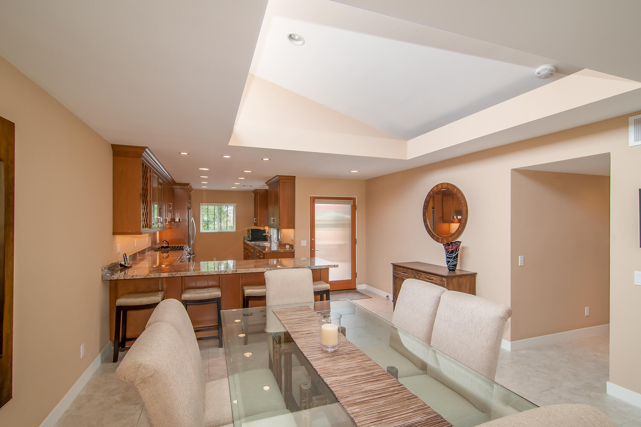 48275 Racquet Lane Palm Desert, CA 92260 - Photo 10 of 29 a living room with furniture a clock and a window