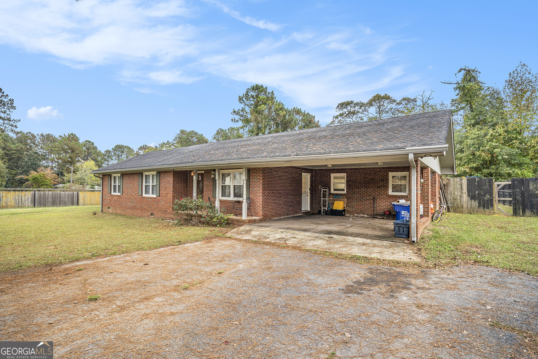 1083 Hampton Road Hampton, GA 30228 - Photo 2 of 27 a view of a house with a yard and entertaining space