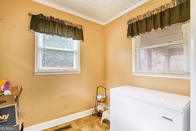 a bathroom with a sink and a window