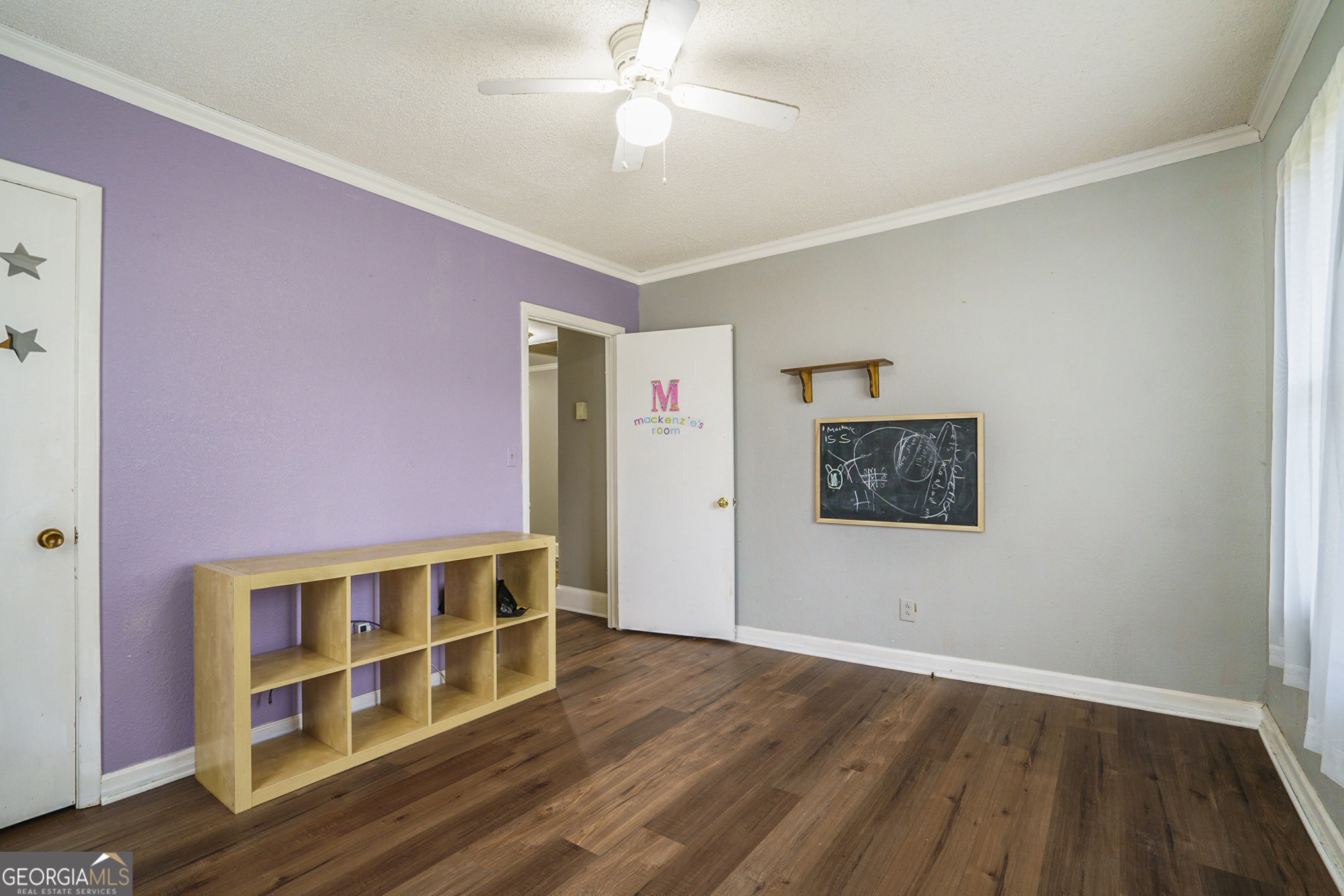 1083 Hampton Road Hampton, GA 30228 - Photo 5 of 27 a view of a livingroom with wooden floor and a ceiling fan