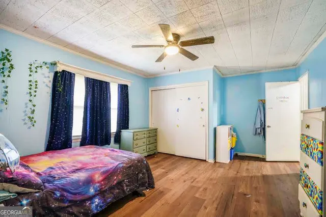 a bed room with a bed and a chandelier