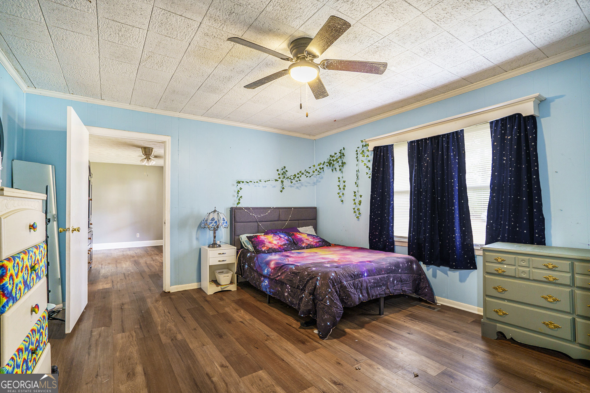1083 Hampton Road Hampton, GA 30228 - Photo 8 of 27 a bedroom with a bed and a dresser