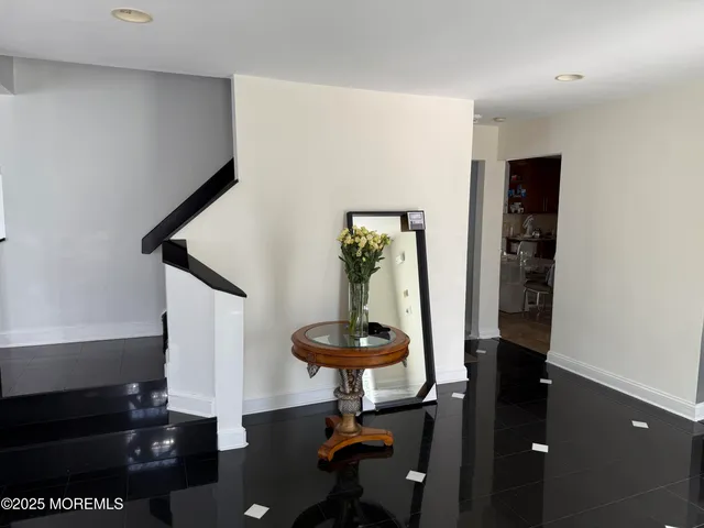 a view of a hallway with seating area