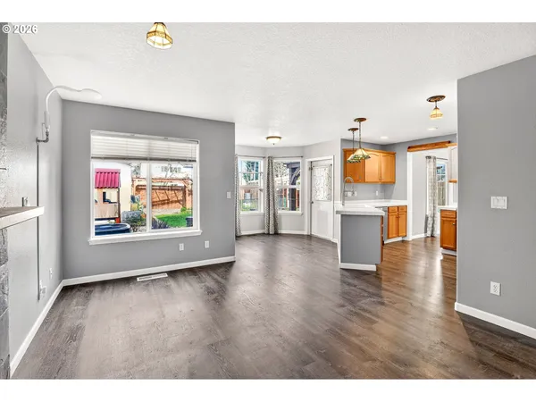 a view of living room with furniture and wooden floor