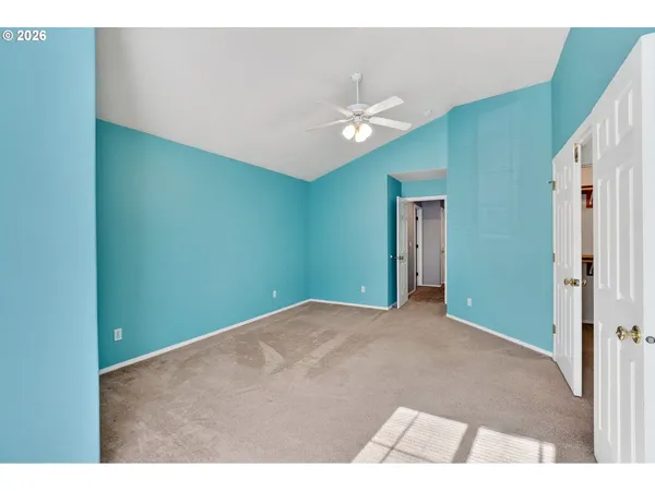 a view of an empty room with a window