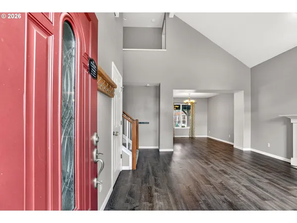 a view of an entryway with wooden floor