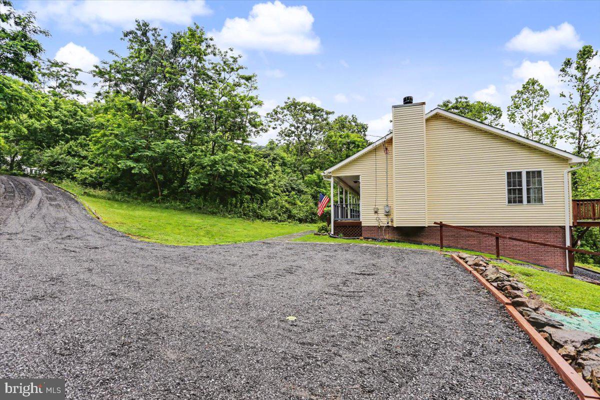 543 Whiskey Still Road Linden, VA 22642 - Photo 5 of 23 a view of a house with a backyard