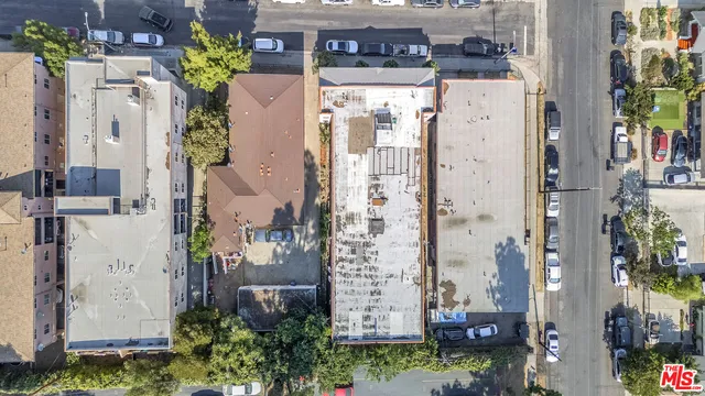 aerial view of a house with yard and seating space