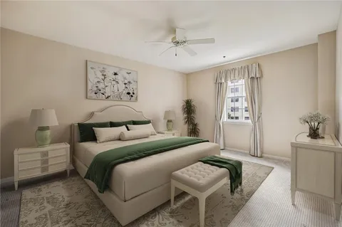 a bedroom with a bed and a couch