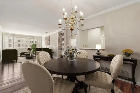 a view of a dining room with furniture and chandelier