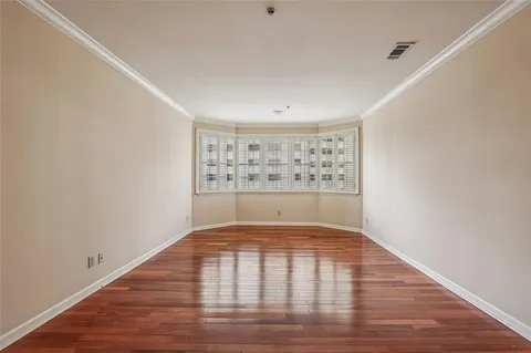 a view of wooden floor in an empty room