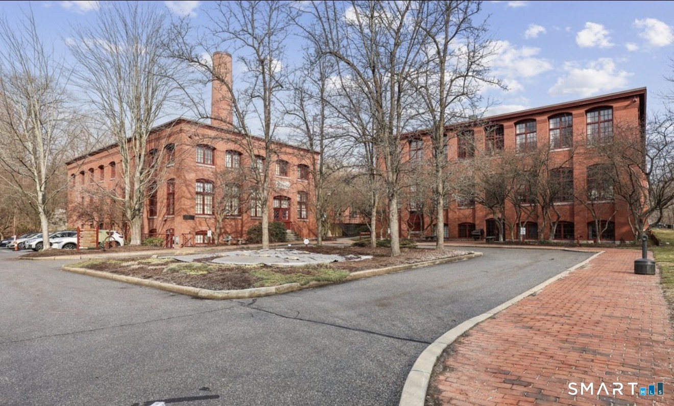 839 Main Street, Unit 68 Torrington, CT 06790 - Photo 19 of 20 a view of a building with a street