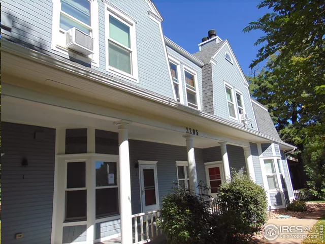 a view of a balcony with wooden floor