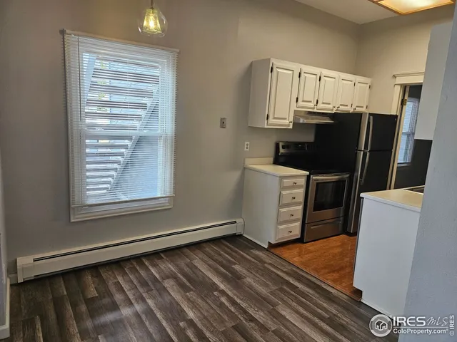 a kitchen with a sink a stove and refrigerator