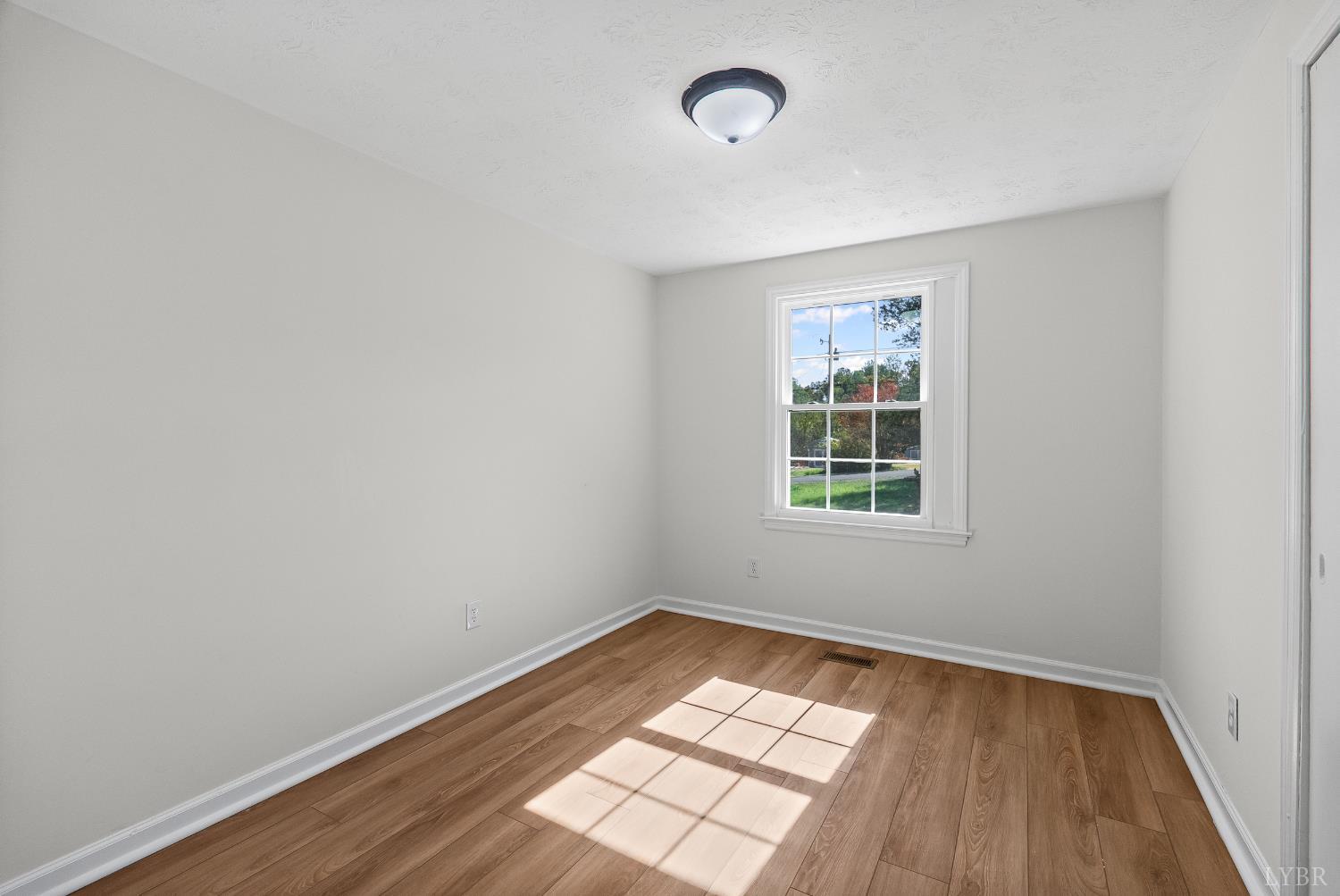 202 Ridgecrest Drive Monroe, VA 24574 - Photo 18 of 25 an empty room with a window