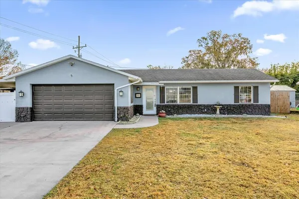 a front view of a house with yard