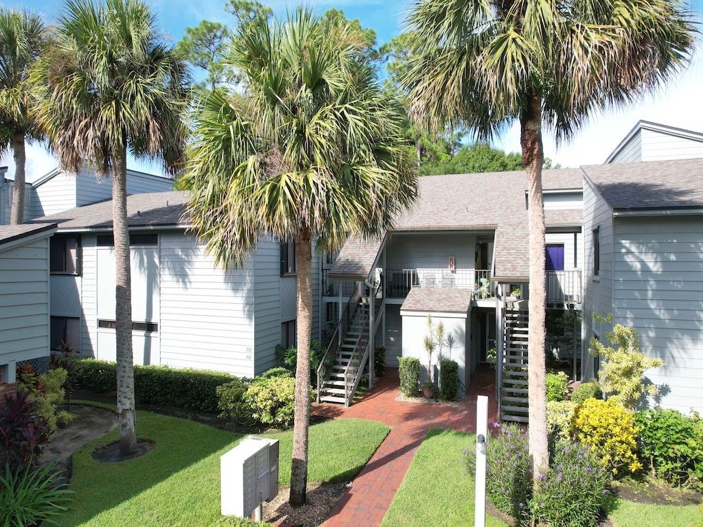 a front view of house and yard with green space
