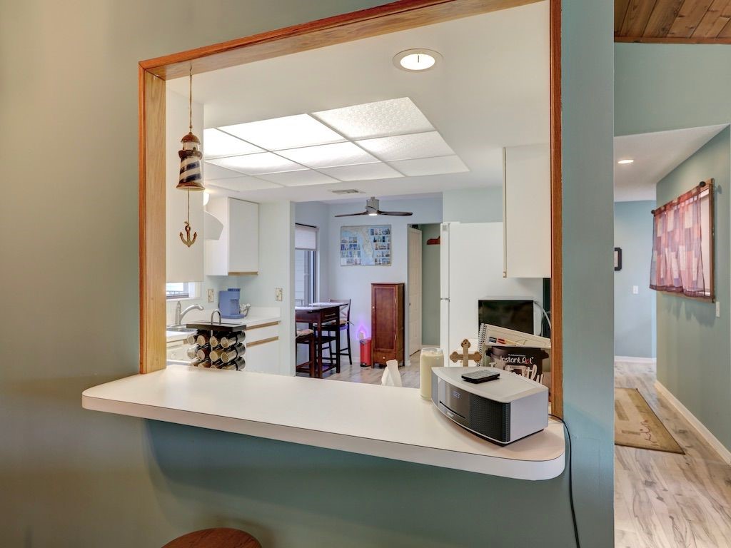 2150 Pine Creek Boulevard, Unit 202 Vero Beach, FL 32966 - Photo 15 of 31 a room with furniture a flat screen tv and a fireplace