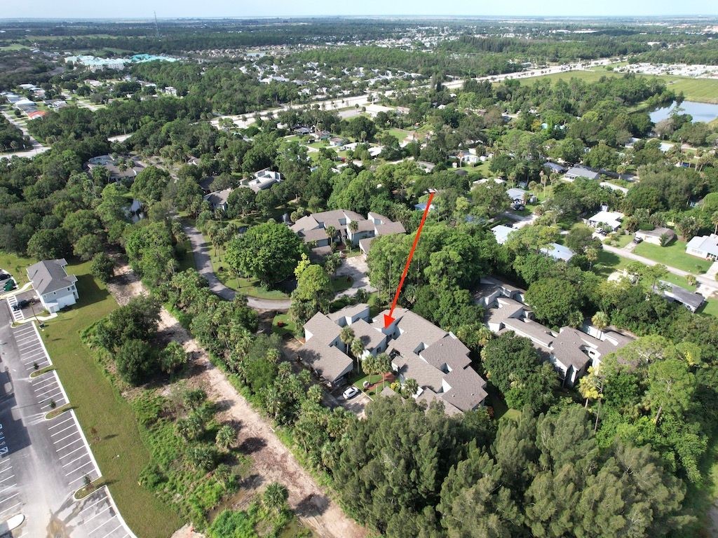 2150 Pine Creek Boulevard, Unit 202 Vero Beach, FL 32966 - Photo 2 of 31 an aerial view of multiple house