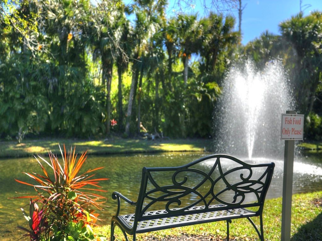 2150 Pine Creek Boulevard, Unit 202 Vero Beach, FL 32966 - Photo 27 of 31 a view of swimming pool with a table and chairs in patio
