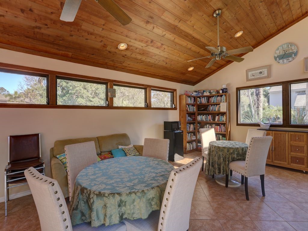 2150 Pine Creek Boulevard, Unit 202 Vero Beach, FL 32966 - Photo 30 of 31 a dining room with furniture and window