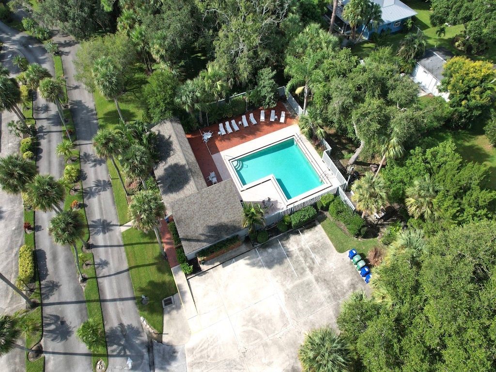 2150 Pine Creek Boulevard, Unit 202 Vero Beach, FL 32966 - Photo 31 of 31 an aerial view of a house with a yard and garden