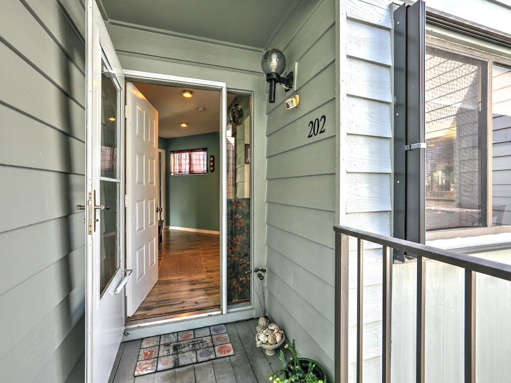 2150 Pine Creek Boulevard, Unit 202 Vero Beach, FL 32966 - Photo 5 of 31 a view of a glass door of the house