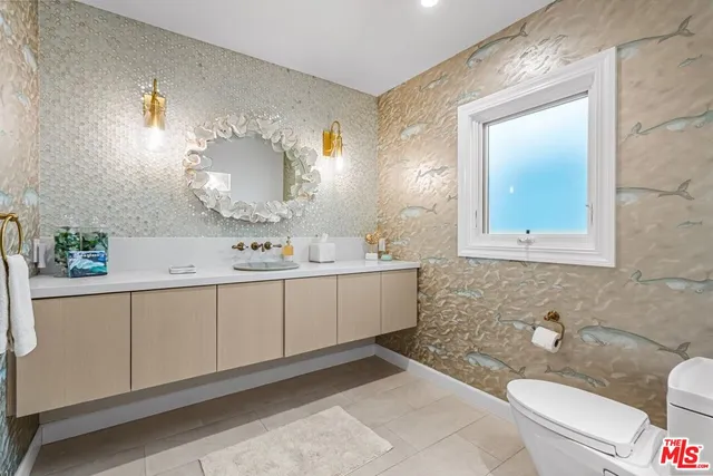 a bedroom with a large bed and a large window