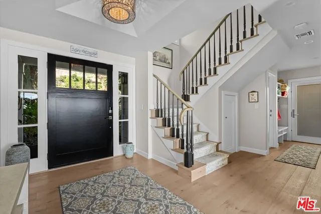 a bathroom with a sink double vanity and a shower