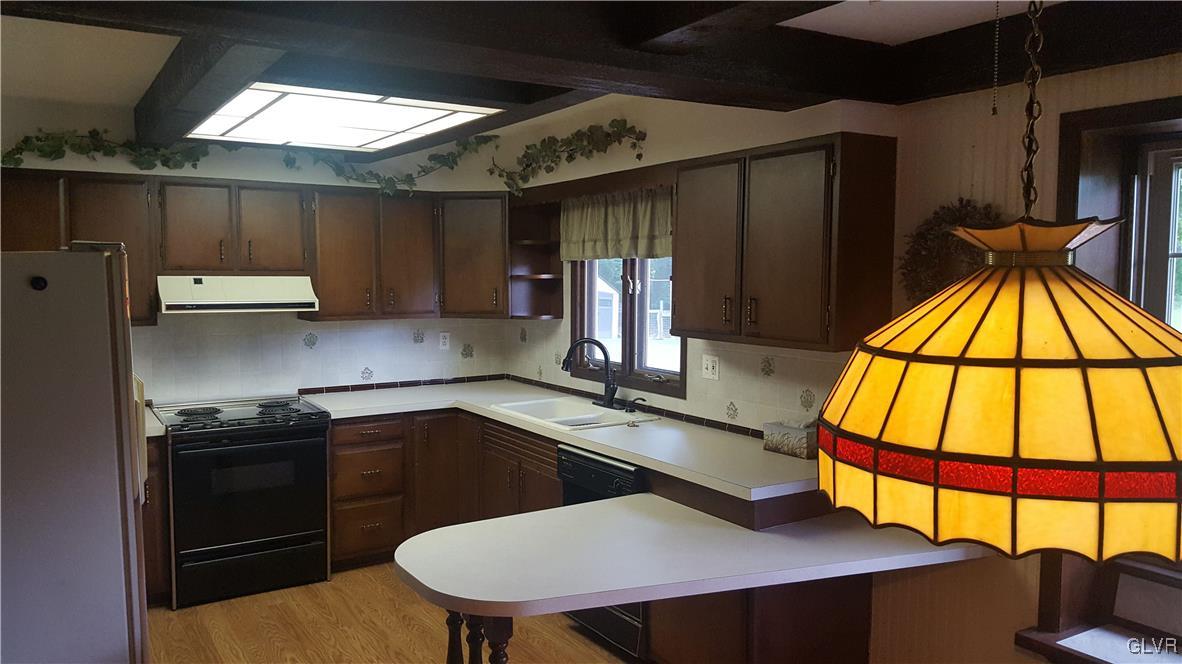 538 Bauer Road Bath, PA 18014 - Photo 17 of 25 a kitchen with a sink a stove and a refrigerator