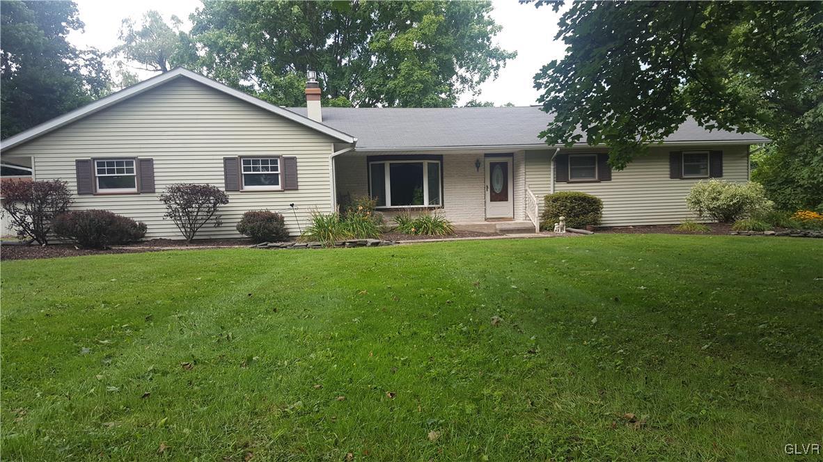 538 Bauer Road Bath, PA 18014 - Photo 2 of 25 a front view of a house with a garden and yard