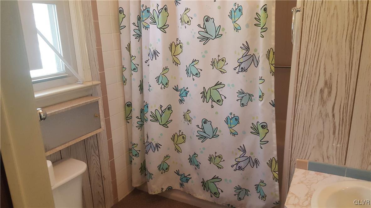 538 Bauer Road Bath, PA 18014 - Photo 25 of 25 a bathroom with a toilet and shower curtain