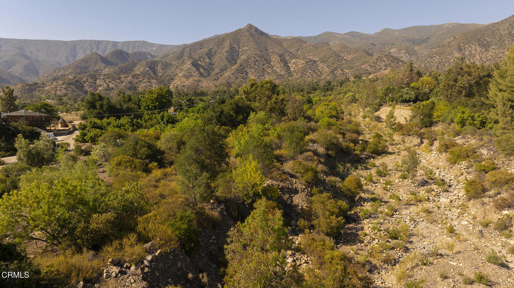 a view of a town with mountains in the background