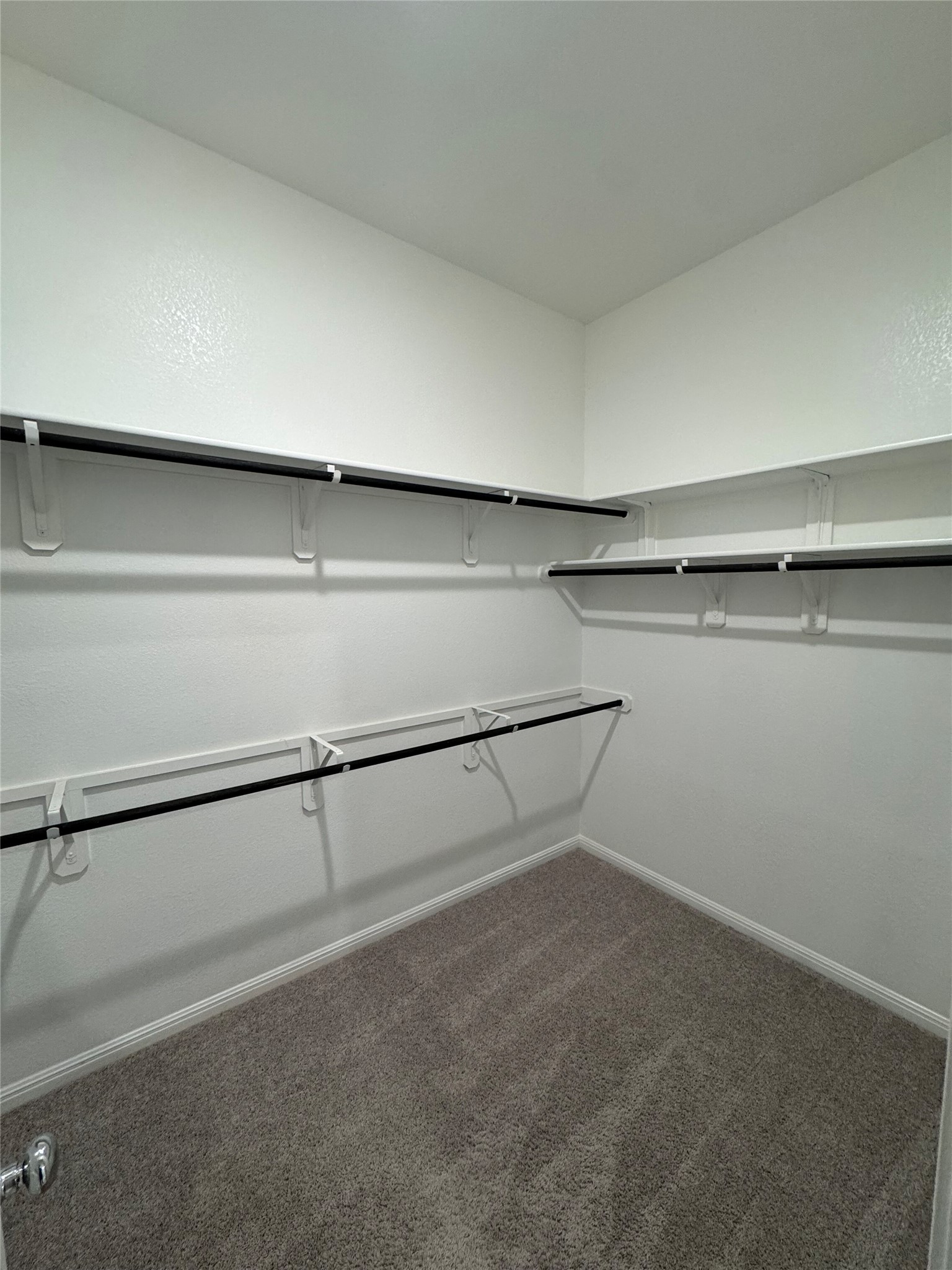 108 Bendecido Loop Elgin, TX 78621 - Photo 10 of 14 a view of a room with racks on the wall