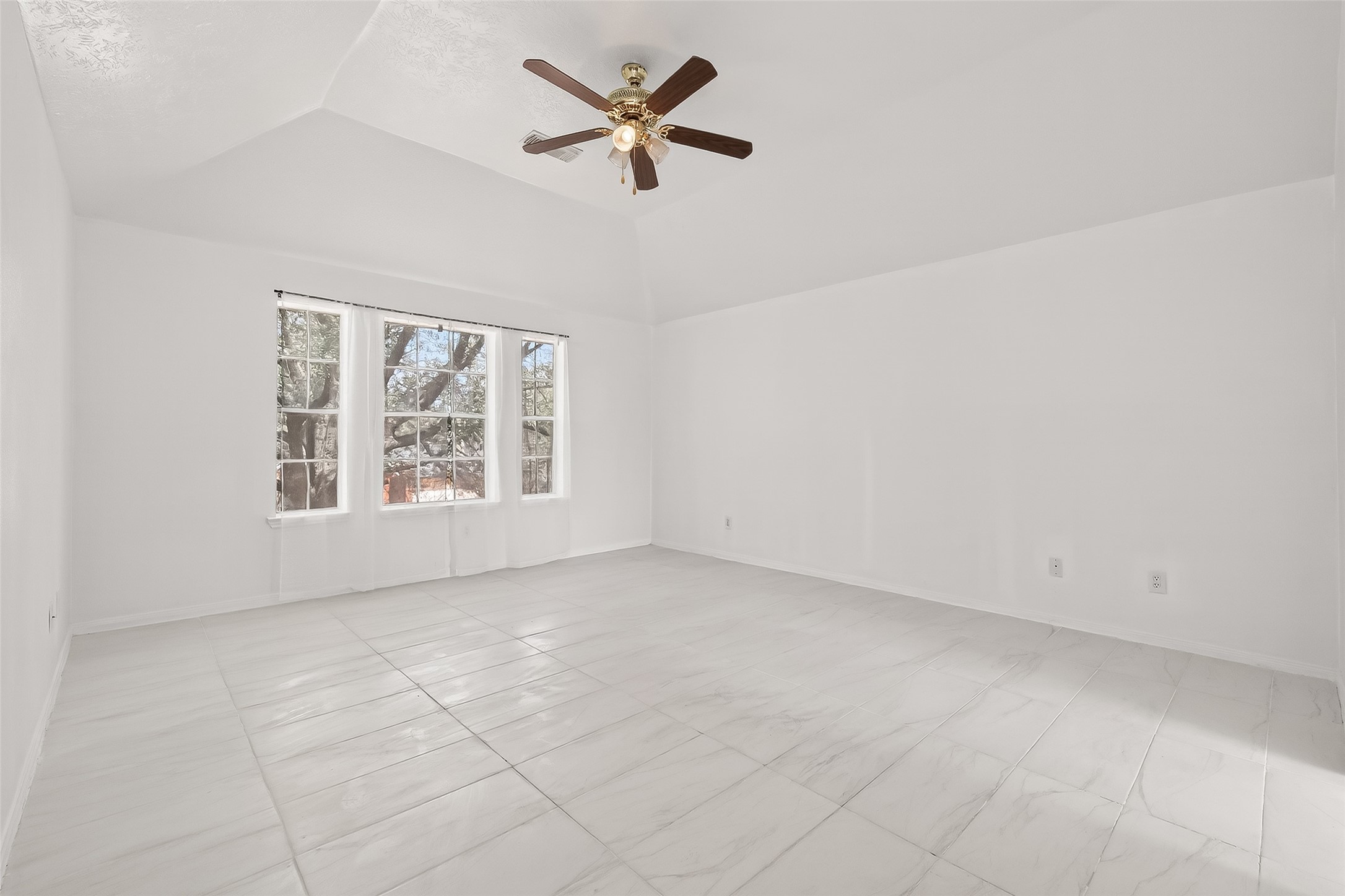 18807 Forest Deer Road Houston, TX 77084 - Photo 22 of 29 an empty room with fan and windows