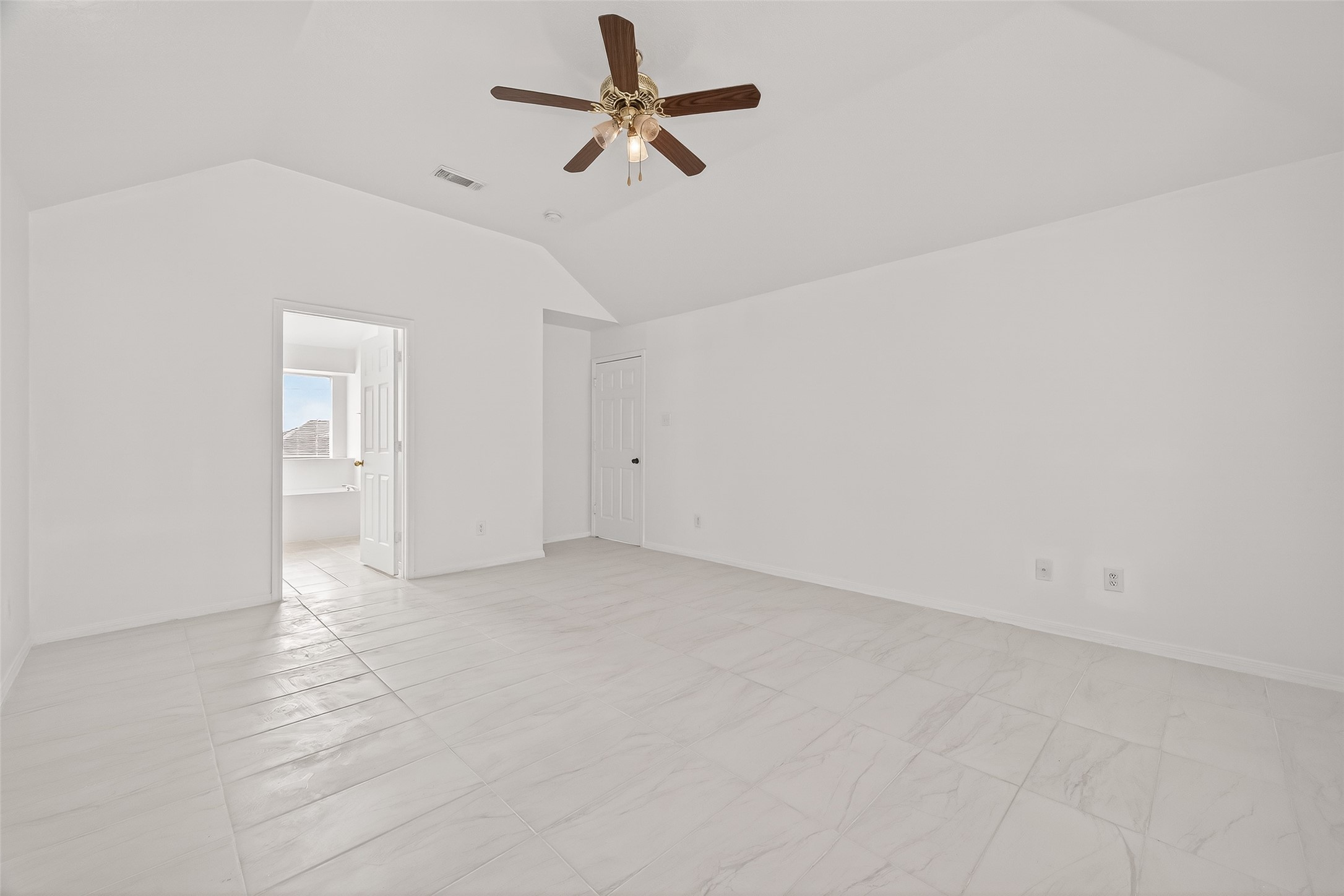 18807 Forest Deer Road Houston, TX 77084 - Photo 23 of 29 an empty room with fan and windows