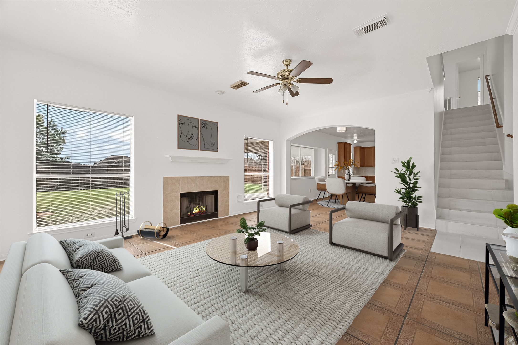 18807 Forest Deer Road Houston, TX 77084 - Photo 28 of 29 a living room with furniture a fireplace and a large window