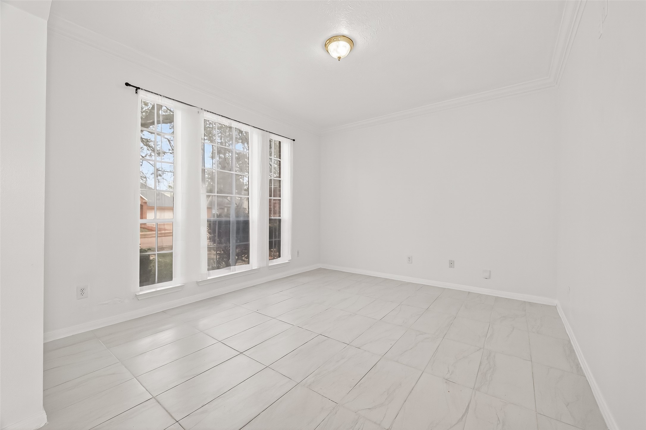 18807 Forest Deer Road Houston, TX 77084 - Photo 5 of 29 a view of an empty room with a window