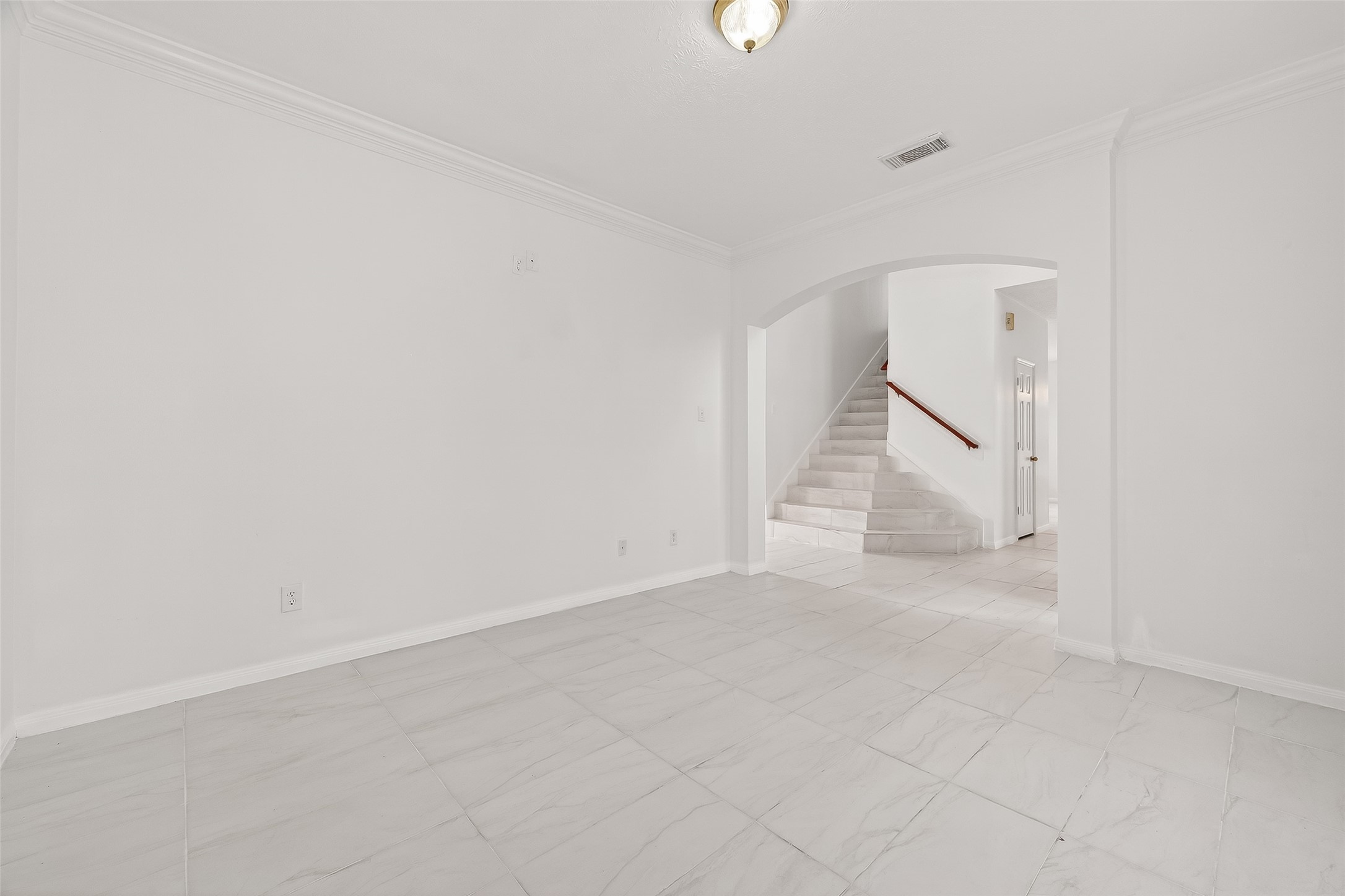 18807 Forest Deer Road Houston, TX 77084 - Photo 7 of 29 an empty room with a ceiling fan and wooden floor