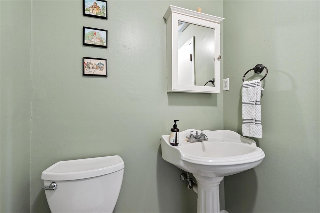 75 Sandy Pond Road, Unit 41 Ayer, MA 01432 - Photo 17 of 36 a bathroom with a sink a toilet and mirror