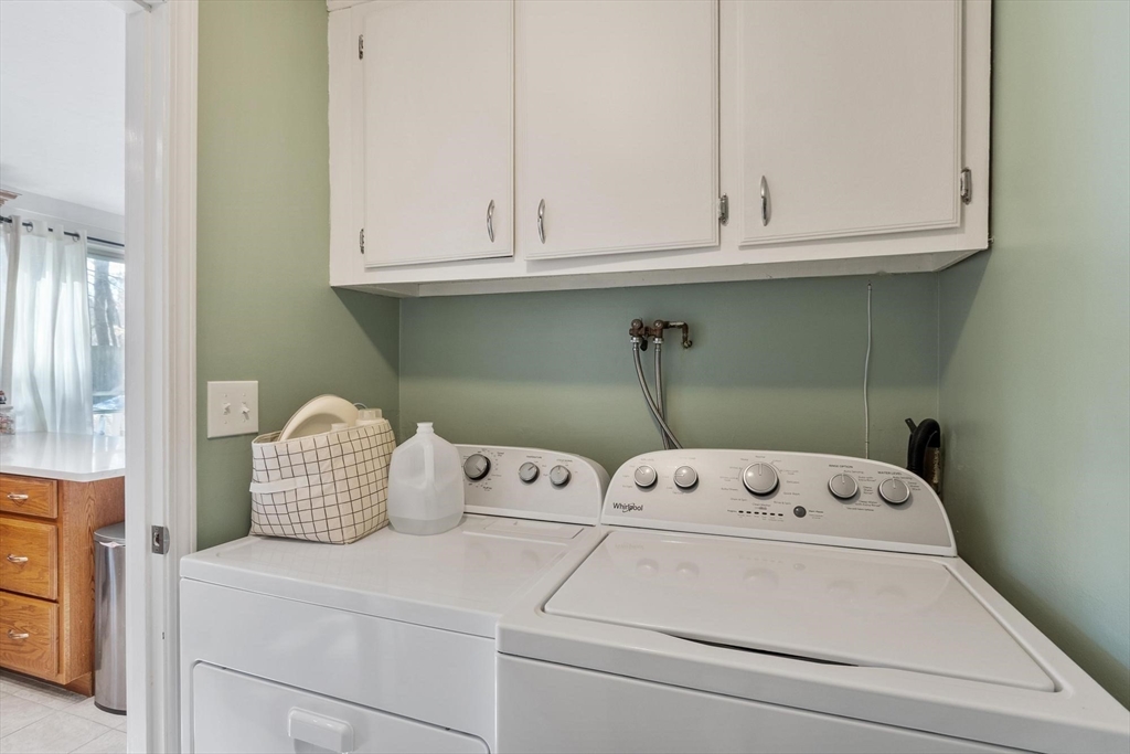 75 Sandy Pond Road, Unit 41 Ayer, MA 01432 - Photo 18 of 36 a utility room with dryer and washer