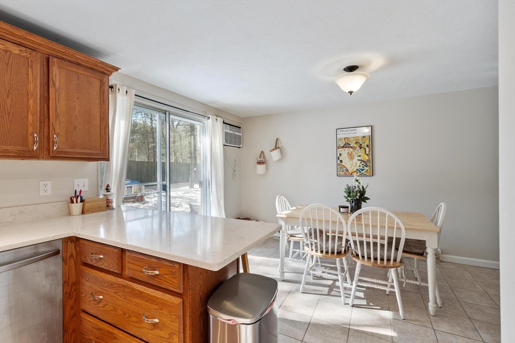 75 Sandy Pond Road, Unit 41 Ayer, MA 01432 - Photo 19 of 36 a dining room with furniture and window