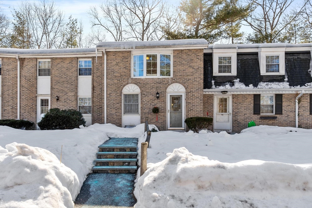 75 Sandy Pond Road, Unit 41 Ayer, MA 01432 - Photo 2 of 36 a front view of a house with a yard