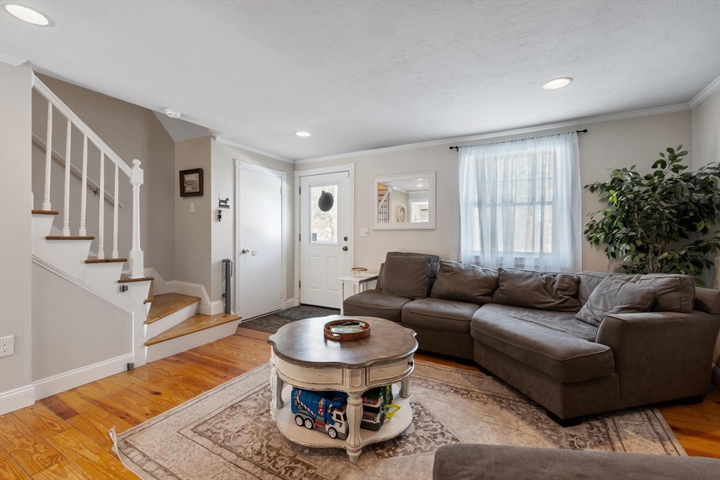 75 Sandy Pond Road, Unit 41 Ayer, MA 01432 - Photo 22 of 36 a living room with furniture and a rug