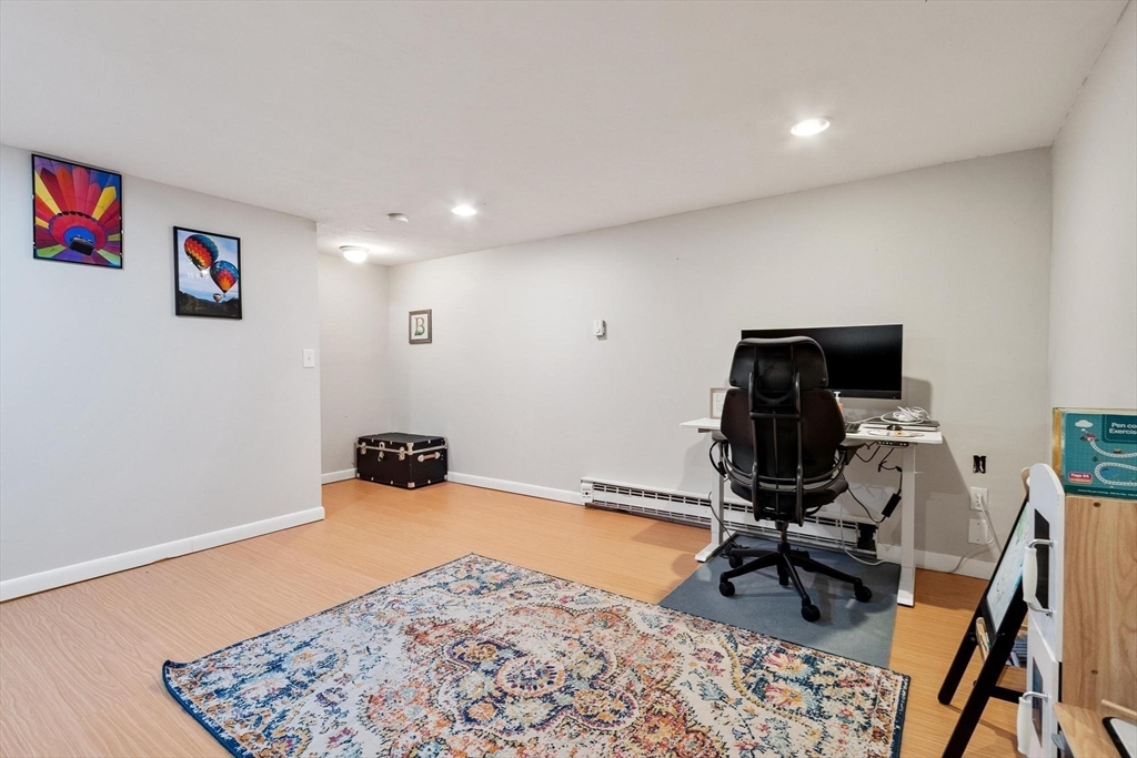 75 Sandy Pond Road, Unit 41 Ayer, MA 01432 - Photo 34 of 36 a room with furniture and a rug