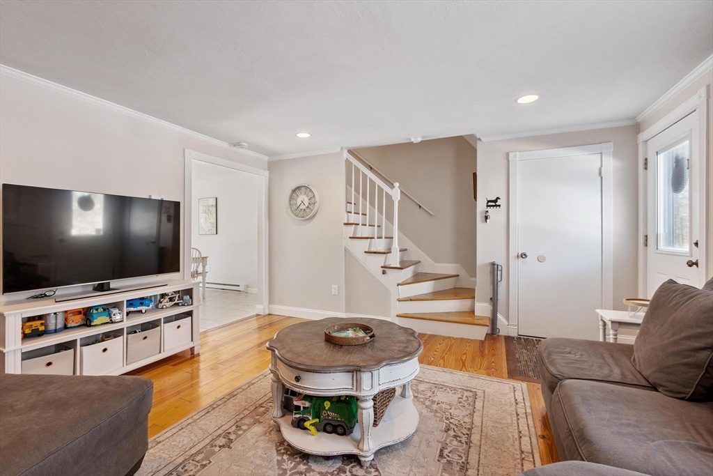 75 Sandy Pond Road, Unit 41 Ayer, MA 01432 - Photo 6 of 36 a living room with furniture and a flat screen tv