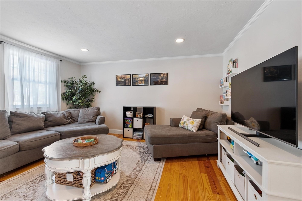 75 Sandy Pond Road, Unit 41 Ayer, MA 01432 - Photo 7 of 36 a living room with furniture and a flat screen tv