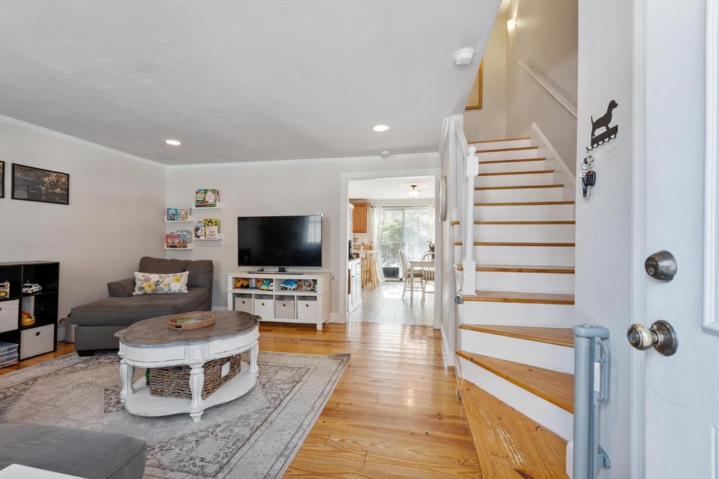 75 Sandy Pond Road, Unit 41 Ayer, MA 01432 - Photo 8 of 36 a living room with furniture and a flat screen tv