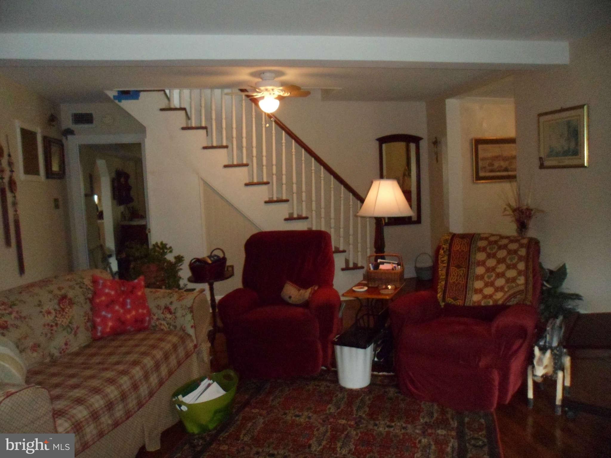 2990 Sixes Road Prince Frederick, MD 20678 - Photo 19 of 30 a living room with furniture and a lamp