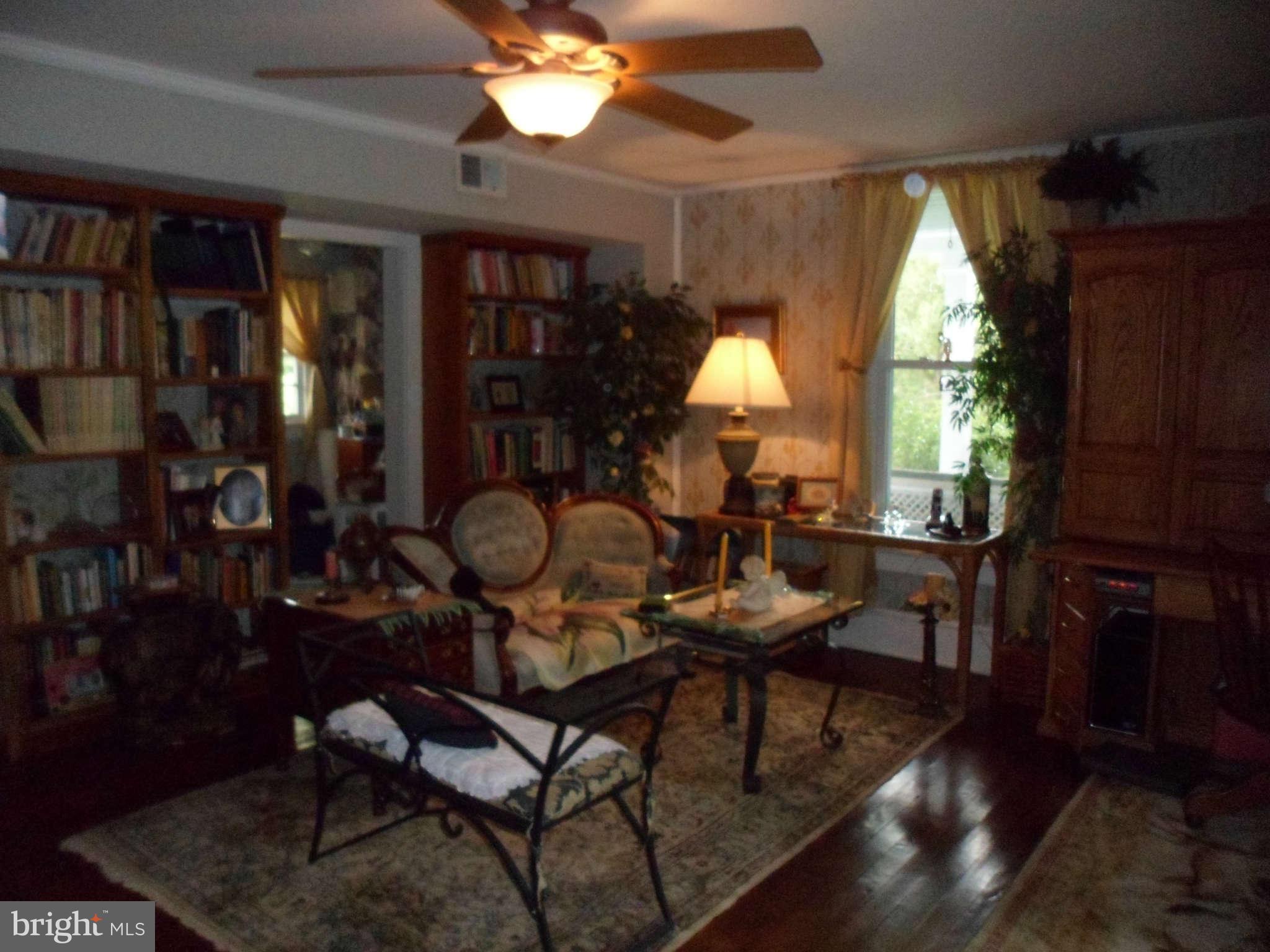 2990 Sixes Road Prince Frederick, MD 20678 - Photo 21 of 30 a living room with furniture a window and a flat screen tv